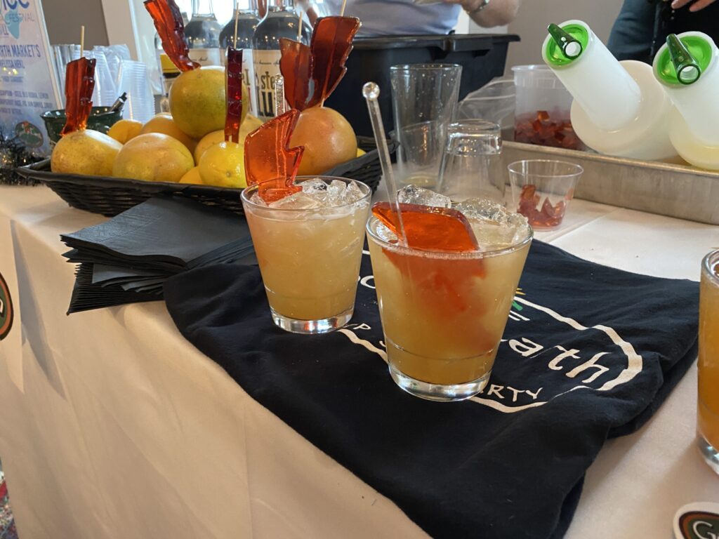 a table topped with glasses filled with drinks