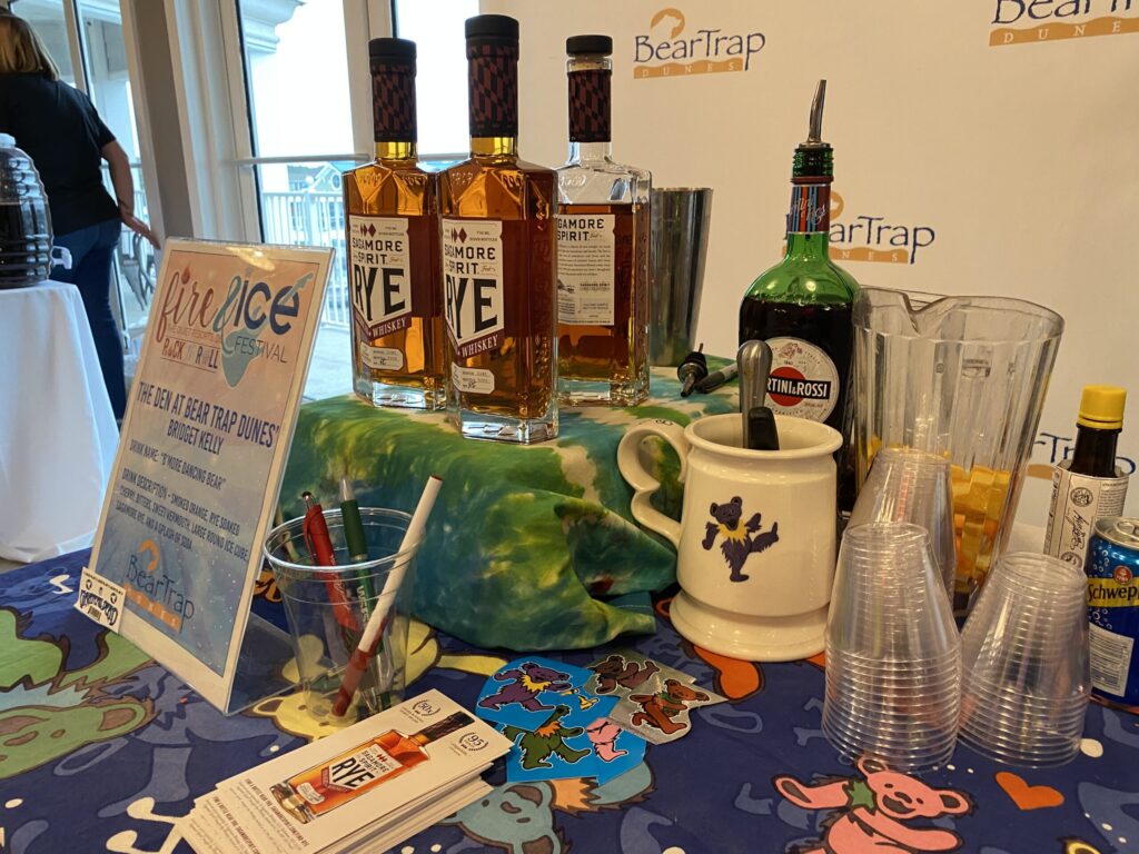 a table topped with bottles of alcohol and glasses