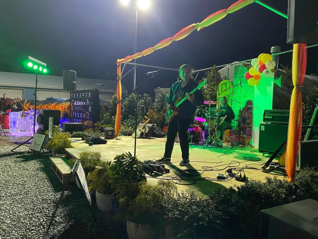a band performing on a stage at night