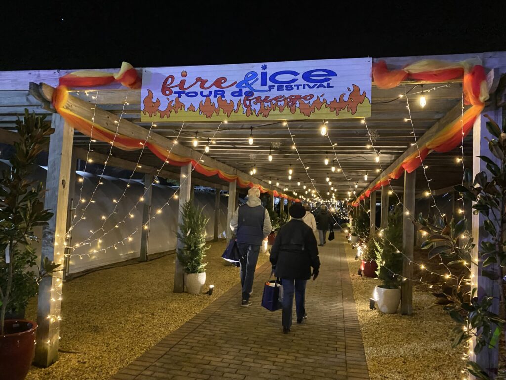a group of people walking under a covered walkway