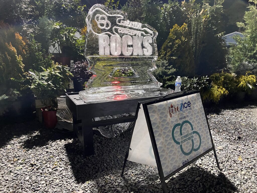 a sign that is sitting in the gravel