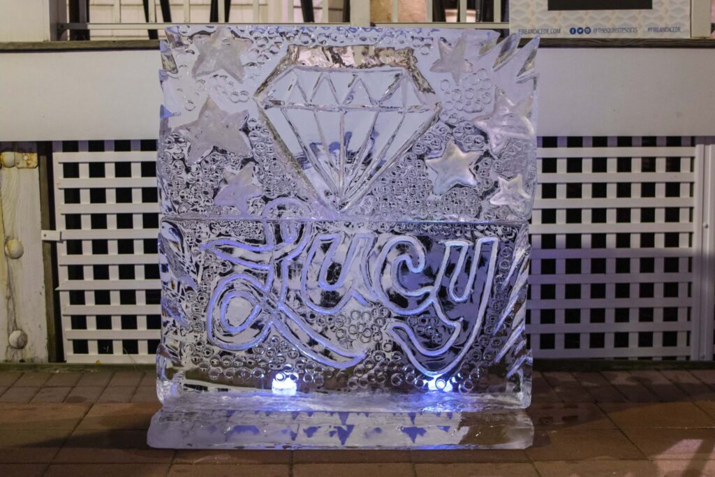 a large ice sculpture sitting on top of a tiled floor