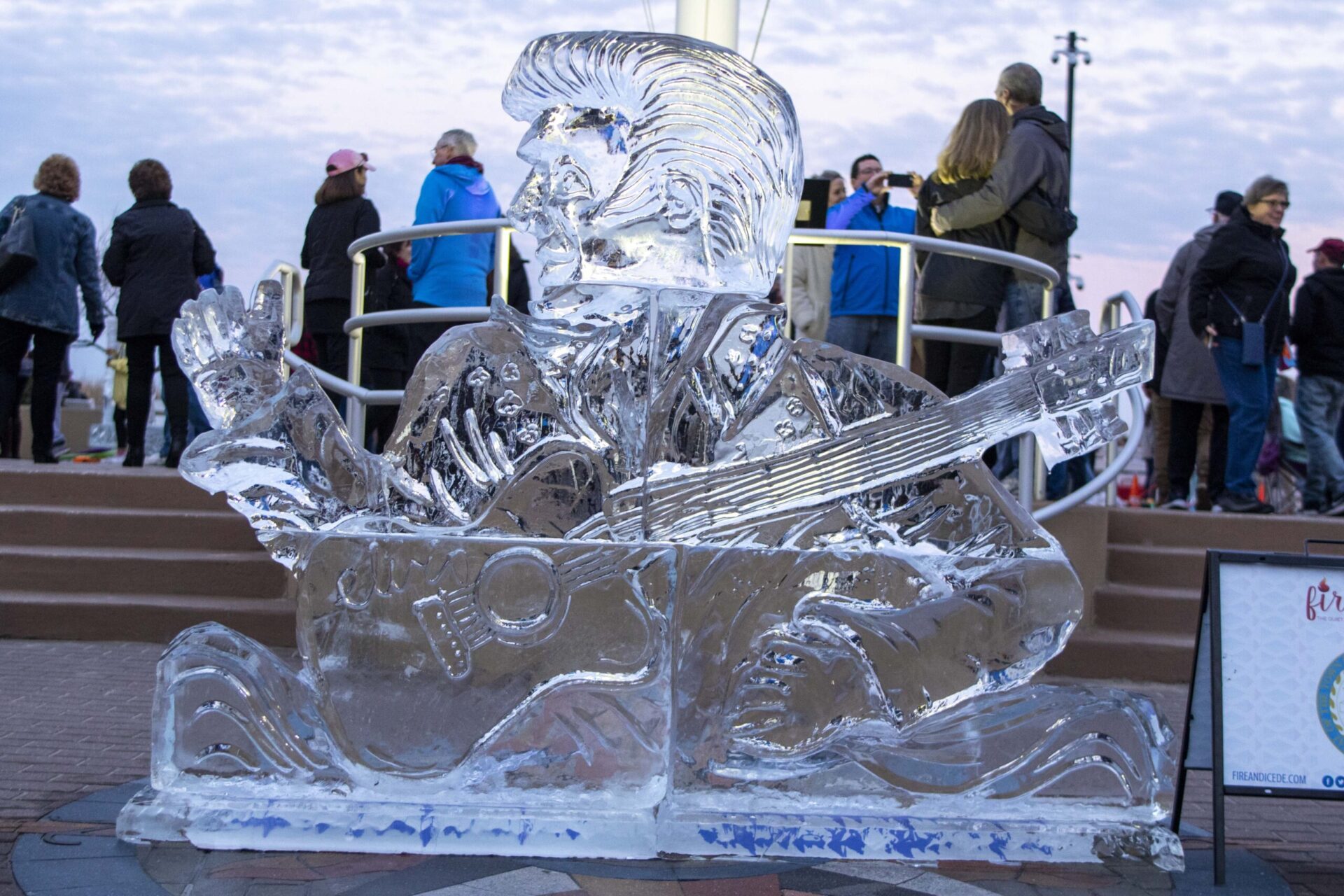 a large ice sculpture of a man playing a guitar