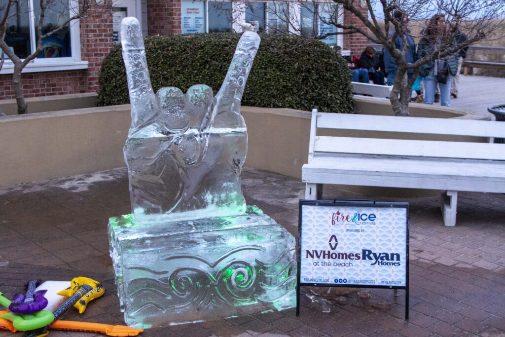 an ice sculpture of a person holding a peace sign