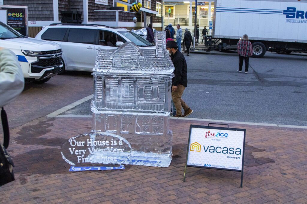 a ice sculpture of a house on a street corner