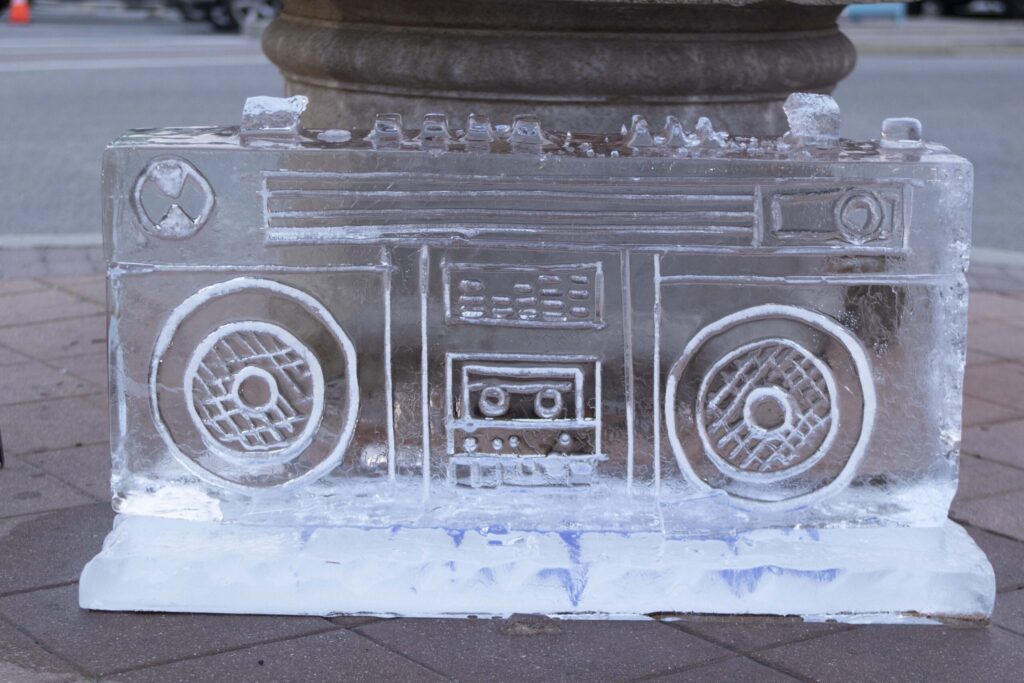 an ice sculpture of a boombox on a city street
