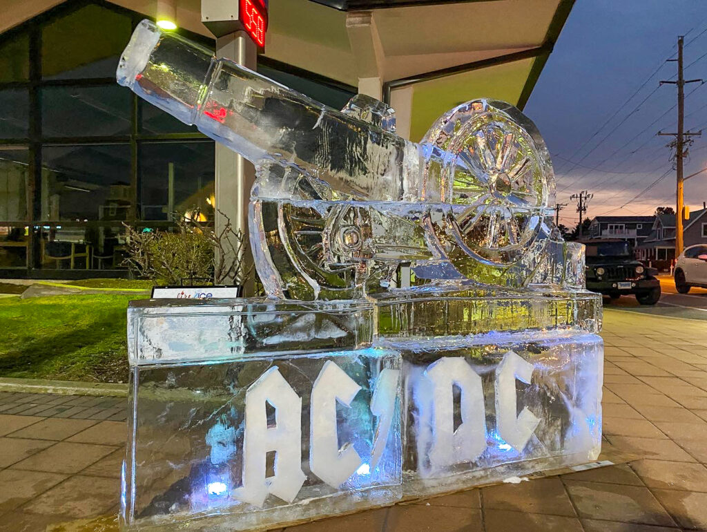 a large ice sculpture sitting on top of a sidewalk