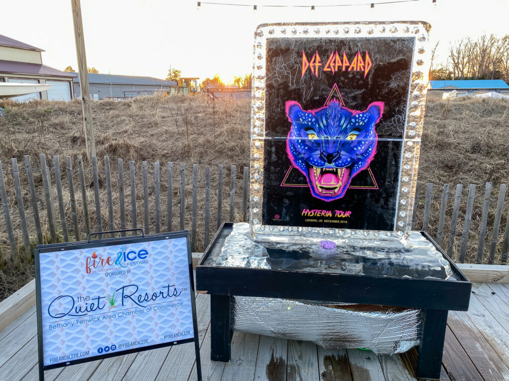 a sign on a deck with a picture of a cat