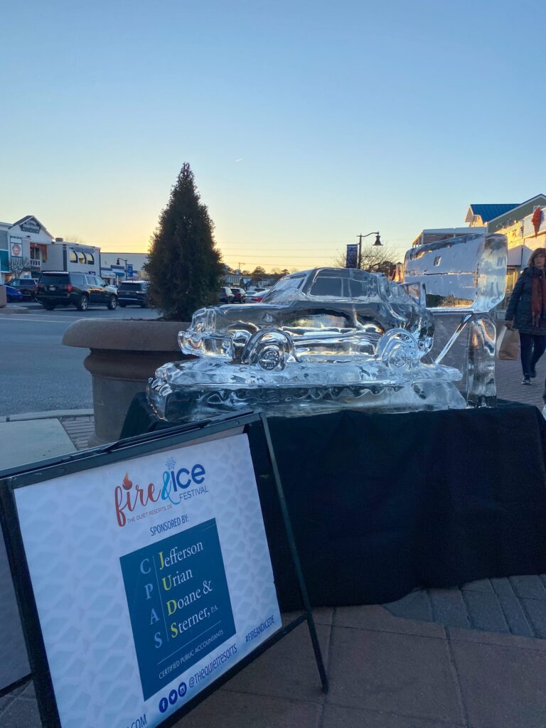 a large ice sculpture sitting on top of a sidewalk