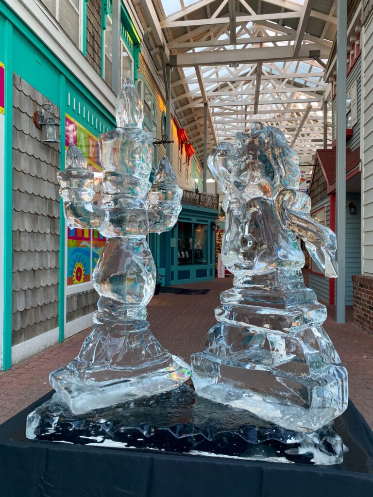 a couple of ice sculptures sitting on top of a table
