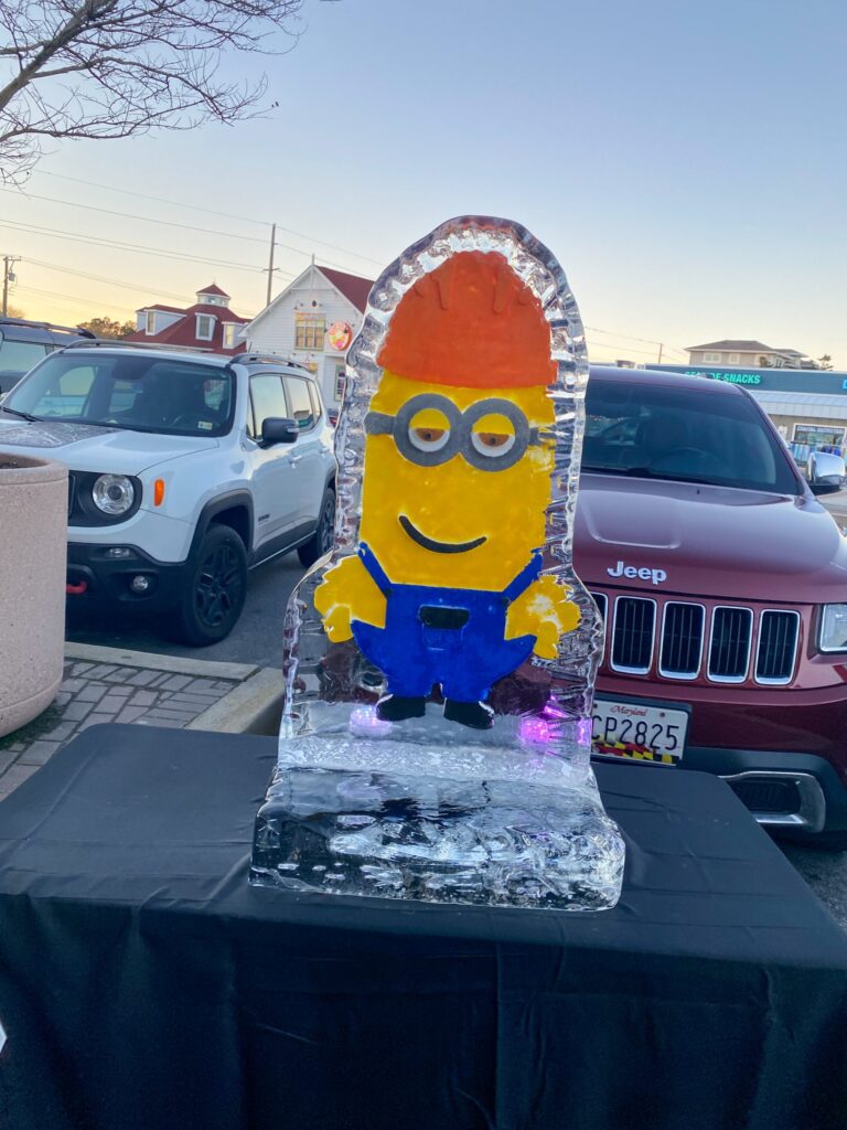a cake made to look like a minion sitting on top of a table