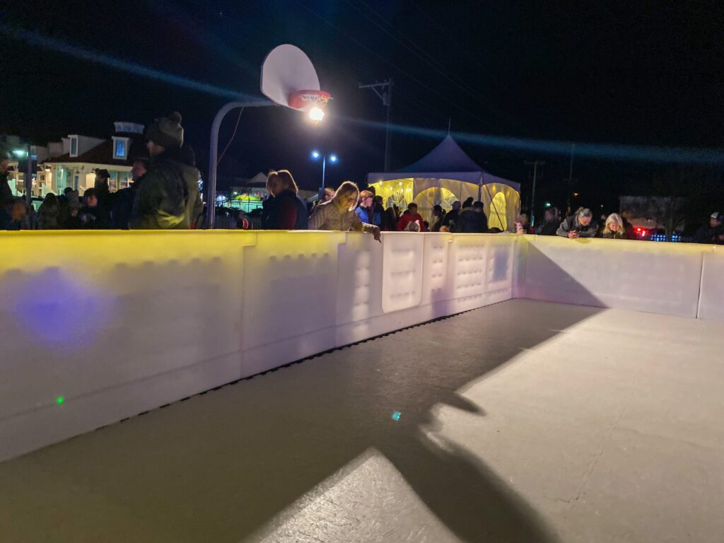 a man riding a skateboard down a ramp at night