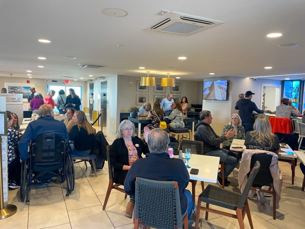 a group of people sitting at tables in a room