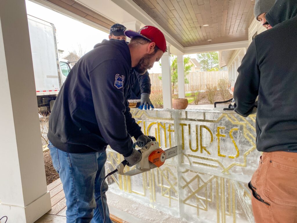 two men are working on a glass window