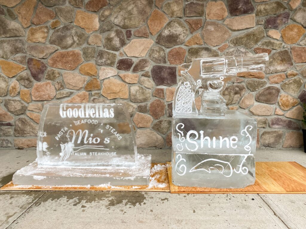 a couple of glass blocks sitting on top of a wooden table