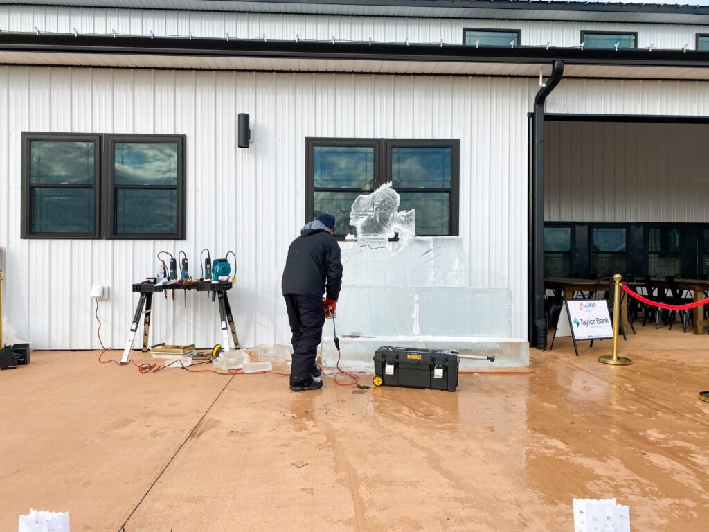 a man standing in front of a white building