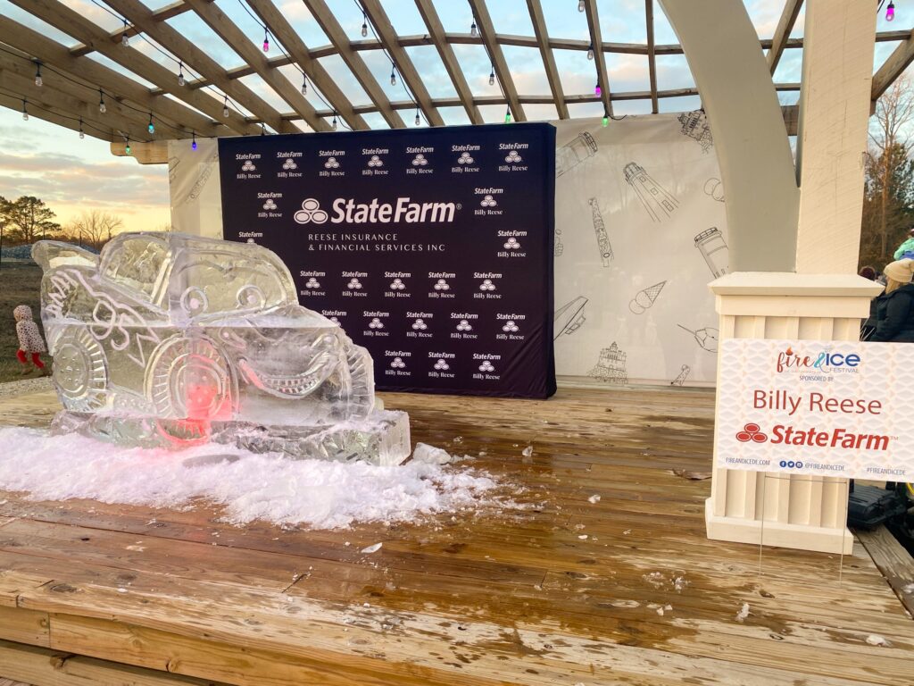 an ice sculpture on a wooden platform at a state farm