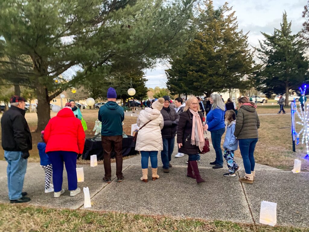 a group of people standing in a park