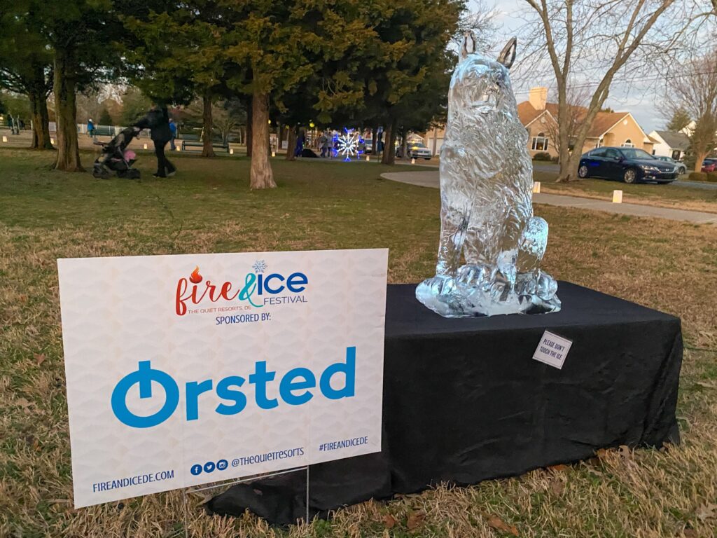 a sign that is on a table in the grass