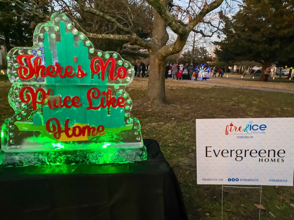 a large green cake sitting on top of a table