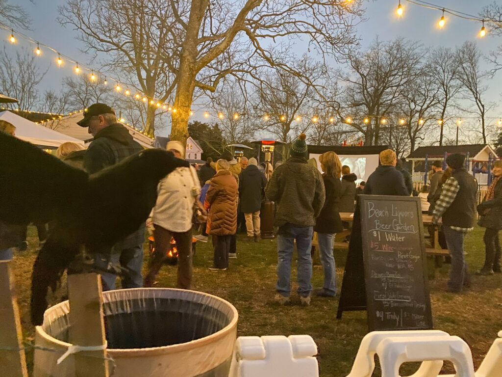 a group of people standing around a tent