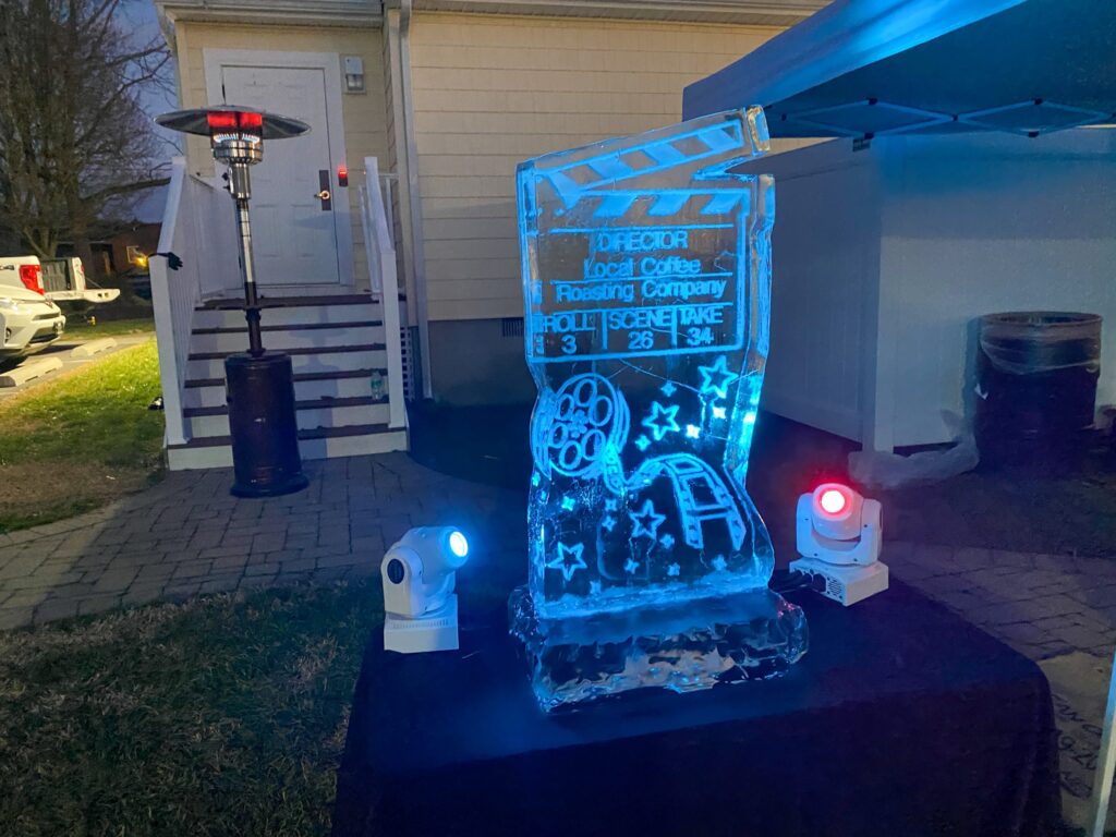 a light up sign in front of a house