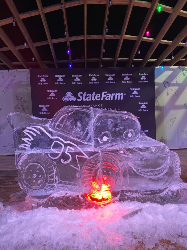 an ice sculpture of a car with a pumpkin on it
