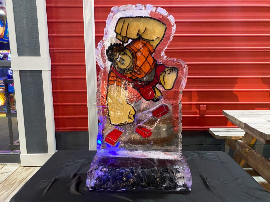 a glass sculpture of a bear holding a basketball