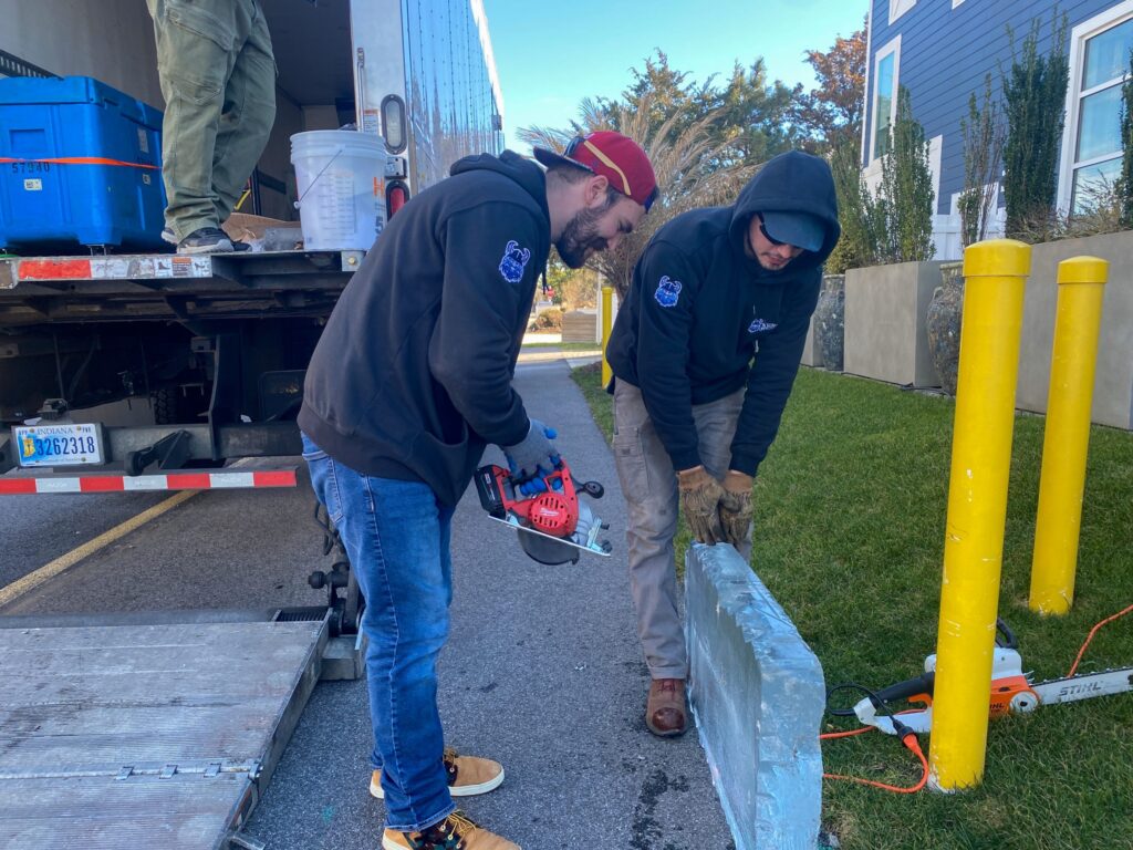 a couple of men standing on top of a truck