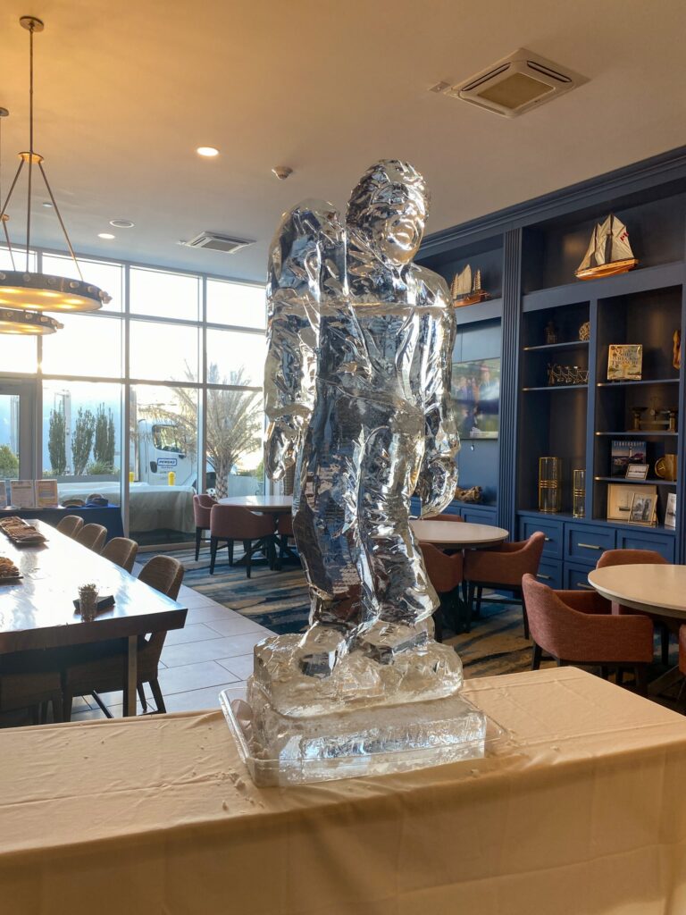 a table with a statue of a man on top of it