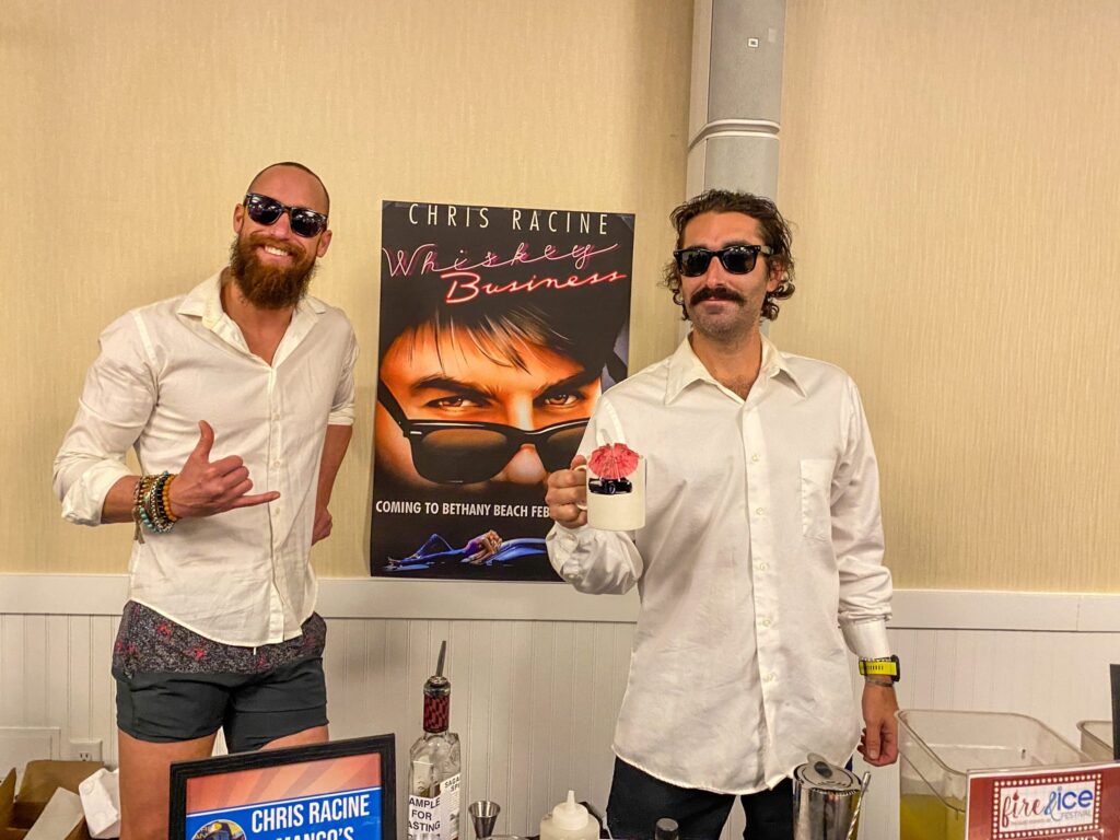 a couple of men standing next to each other