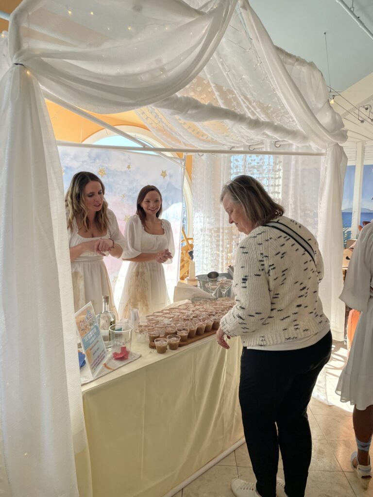 a group of women standing around a table