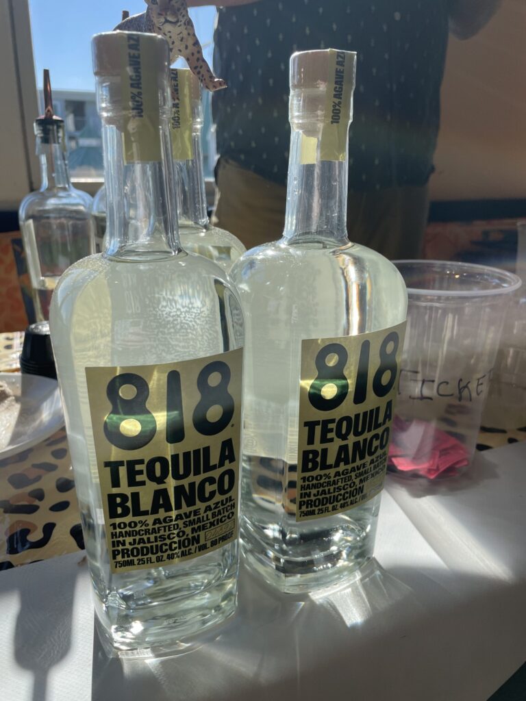 a couple of bottles of tequila sitting on a table