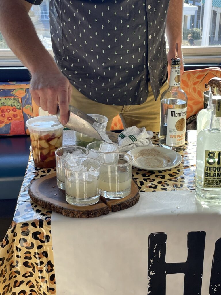 a man preparing food on top of a table