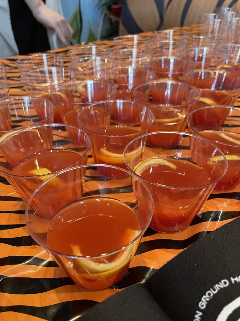 a table topped with lots of glasses filled with liquid