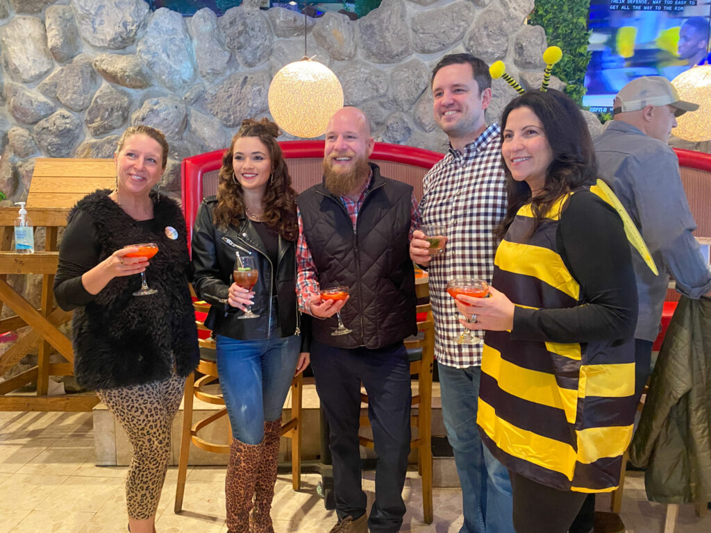 a group of people standing next to each other