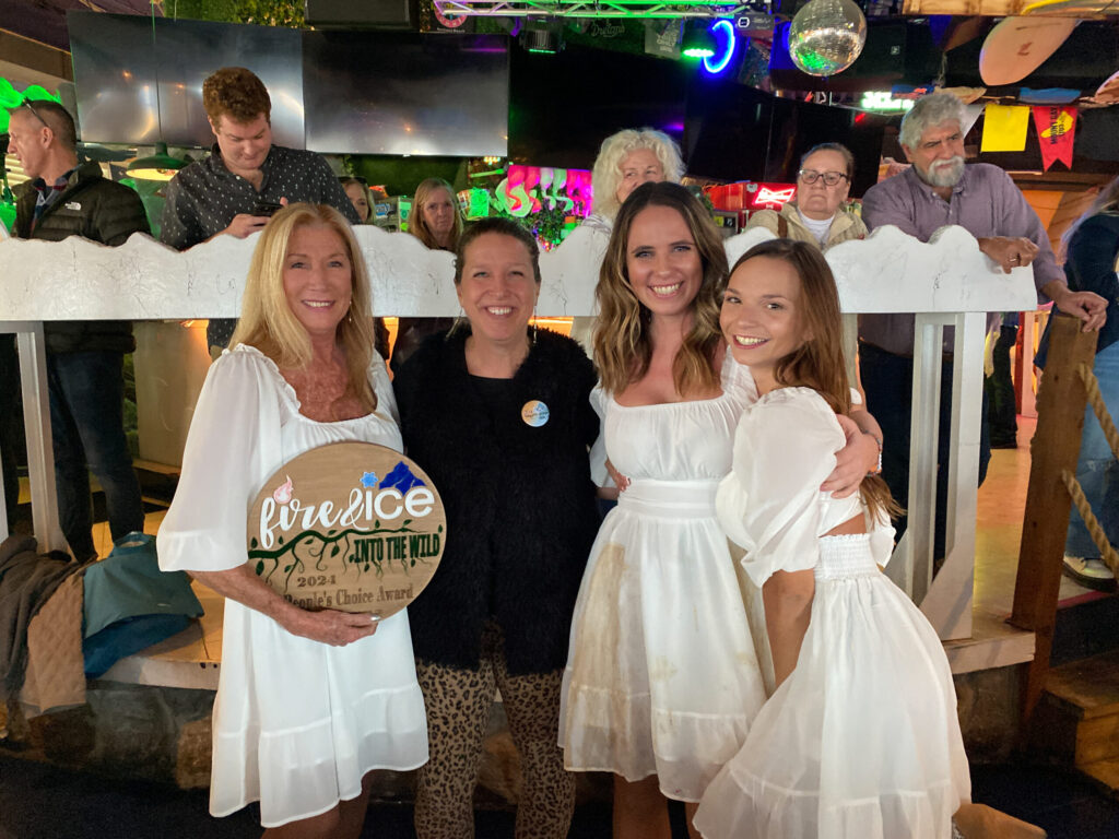a group of women standing next to each other