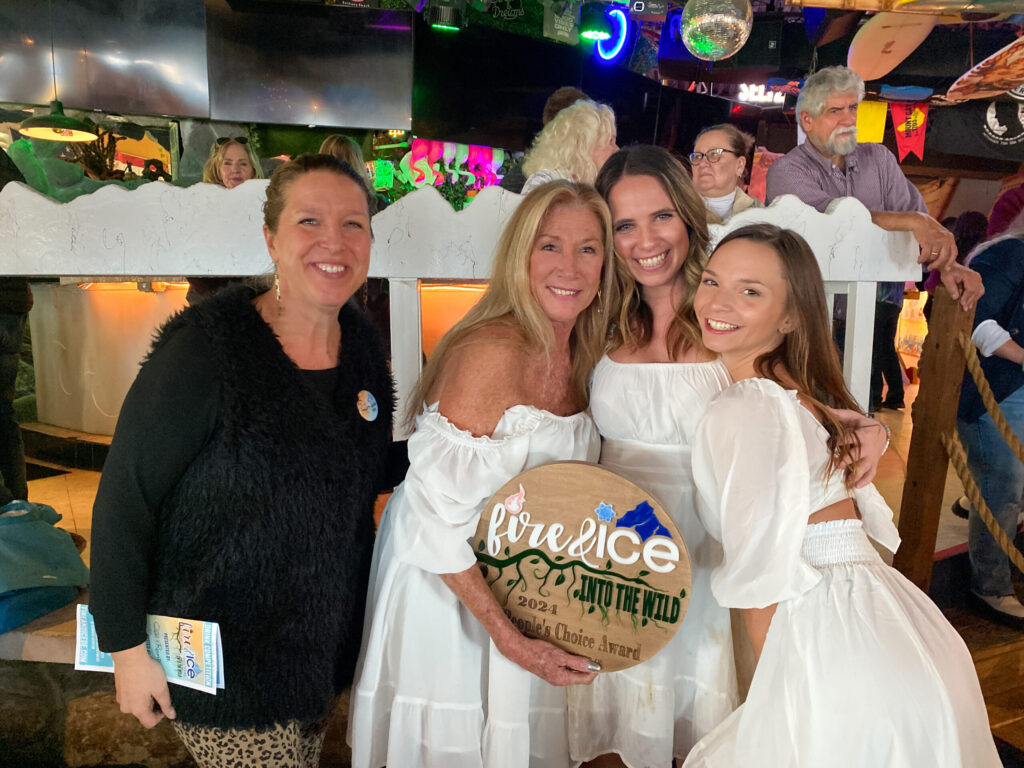 a group of women standing next to each other