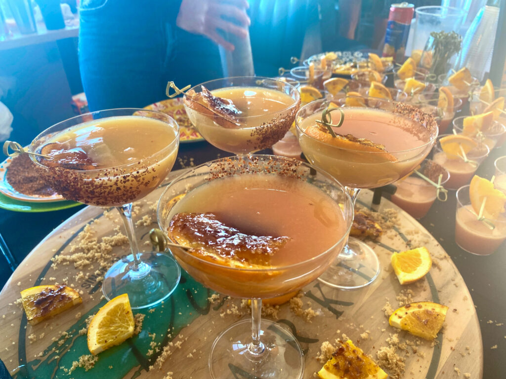 a table topped with glasses filled with drinks