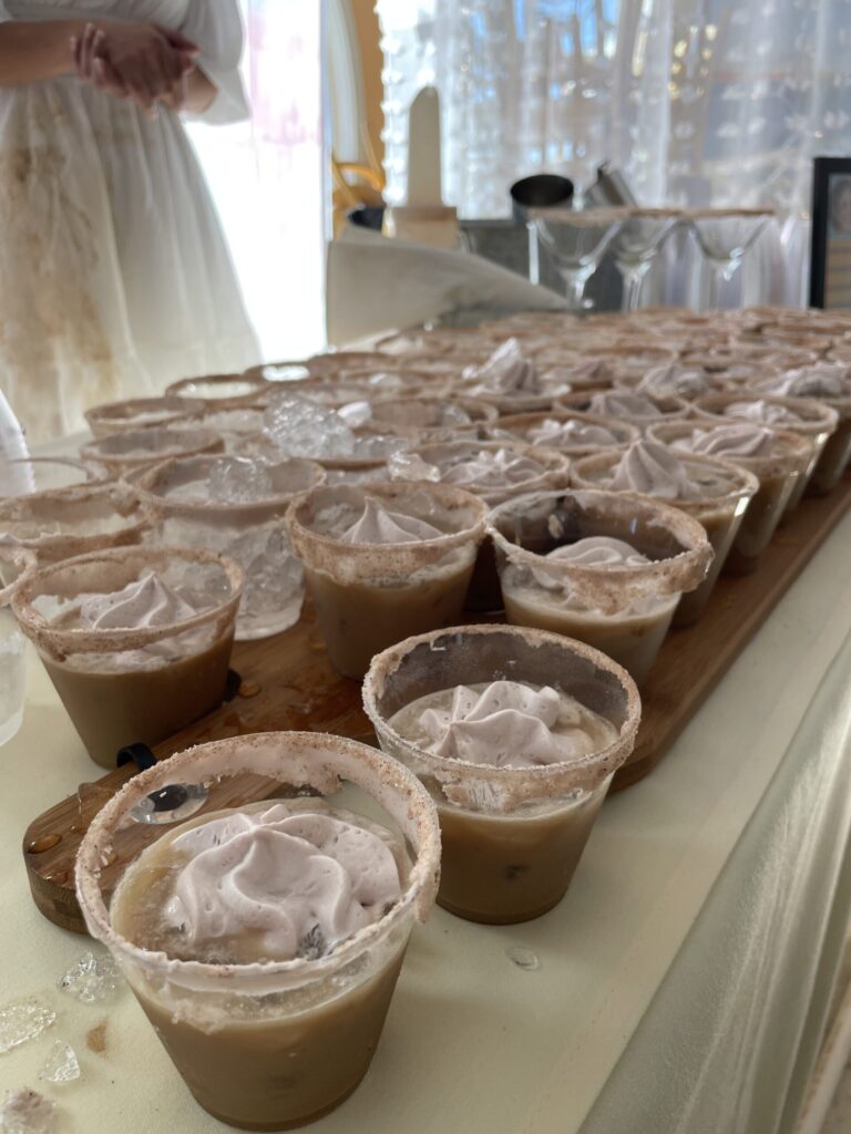 a table topped with cups filled with ice cream