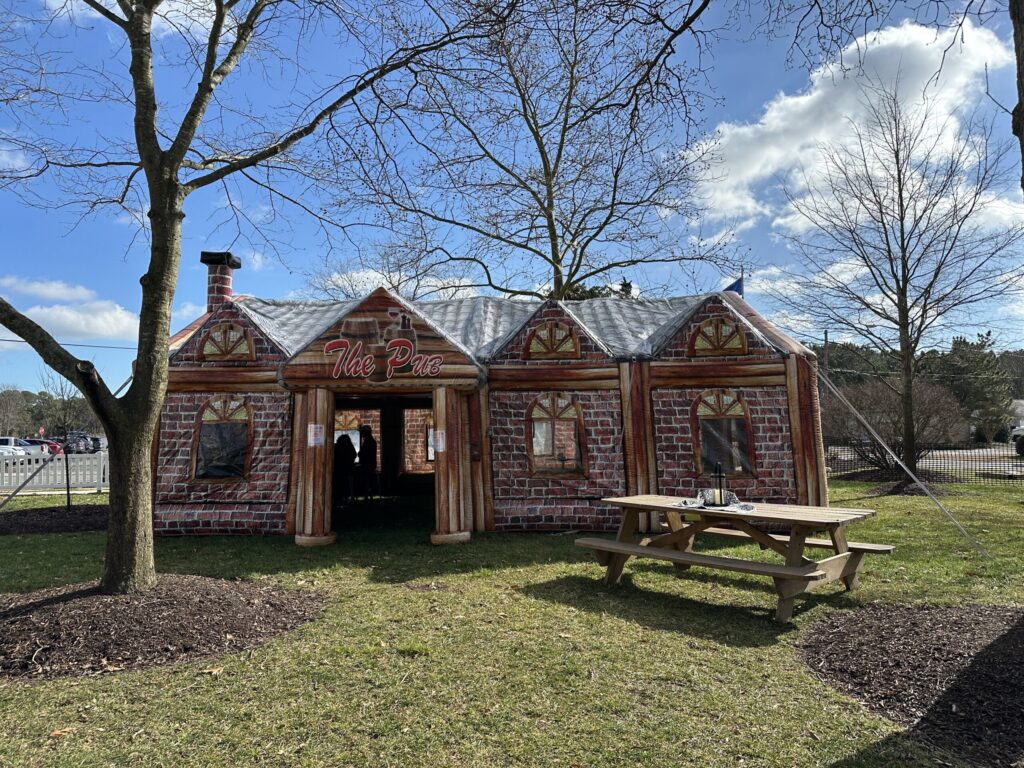 a small brick building with a picnic table in front of it