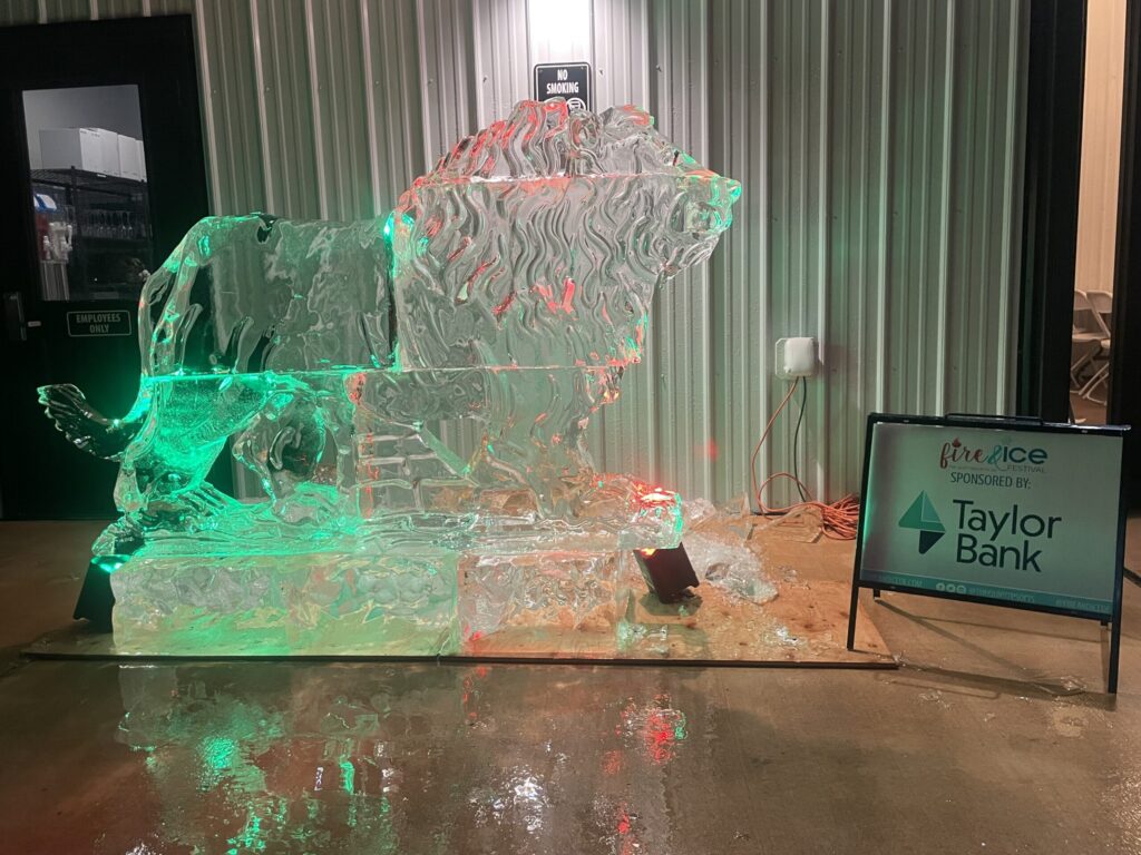 a large ice sculpture of a horse and carriage