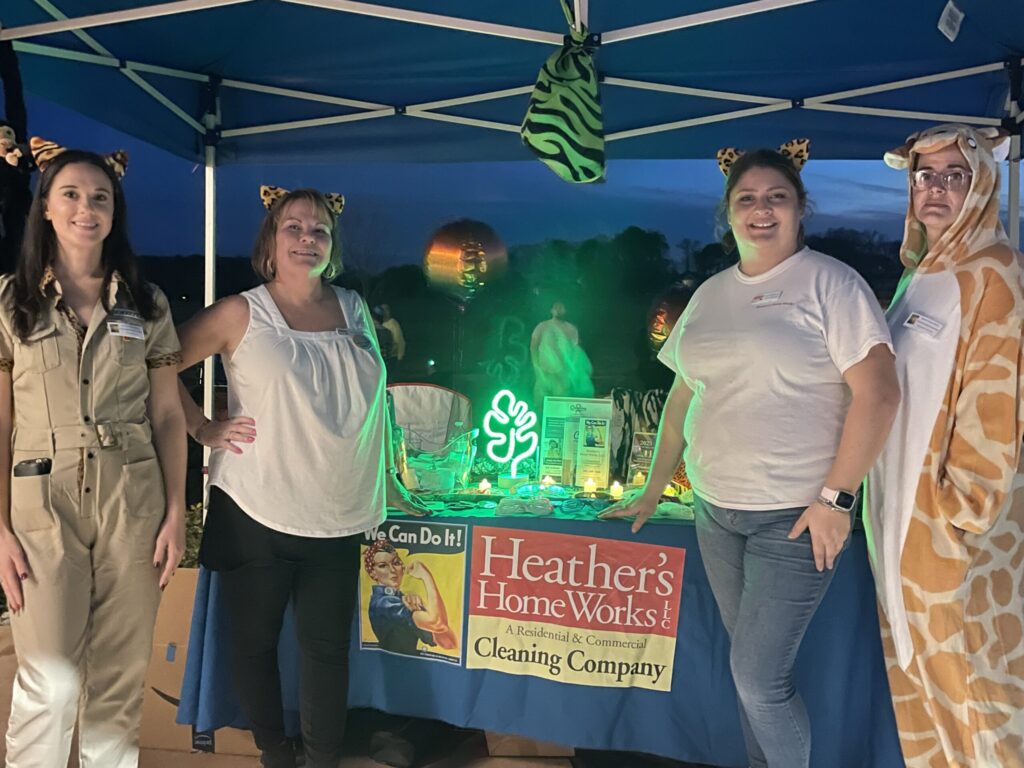 a group of people standing under a tent