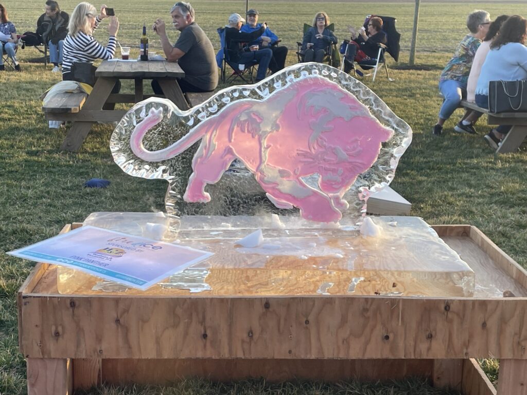 a table with a glass elephant on top of it