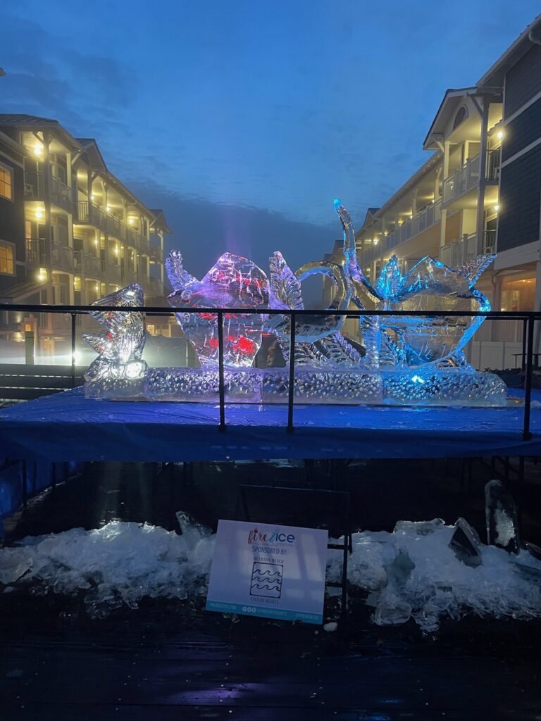 an ice sculpture in front of a building at night