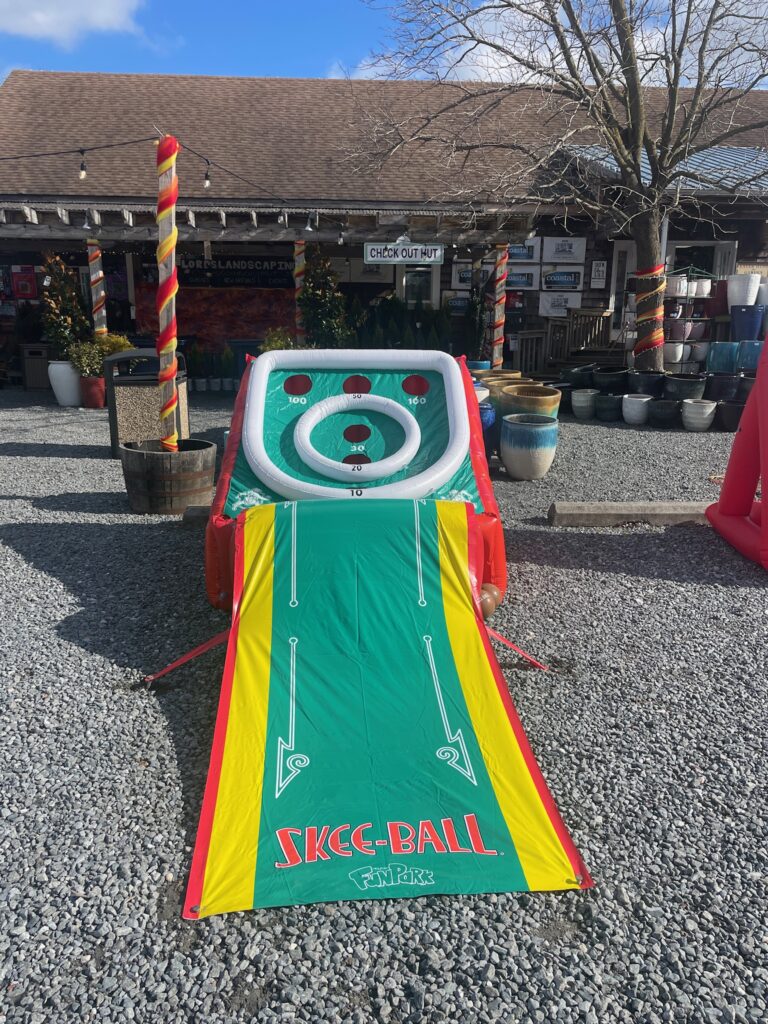 a large inflatable game set up on gravel