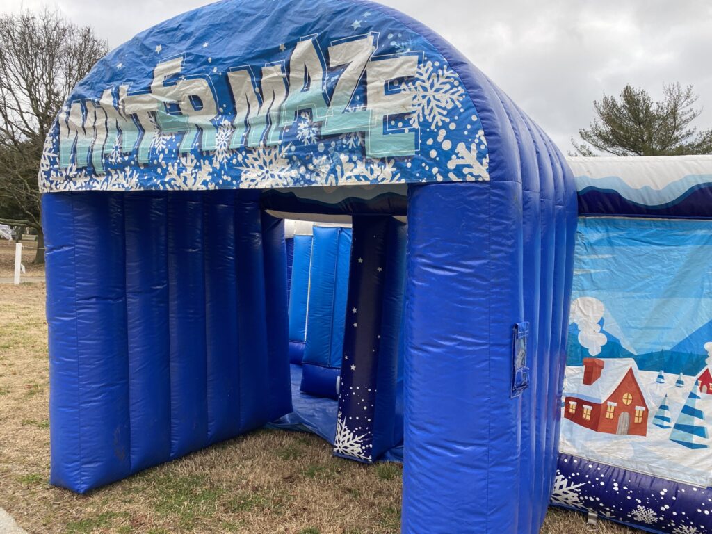 a blue inflatable tent with a snow scene on it