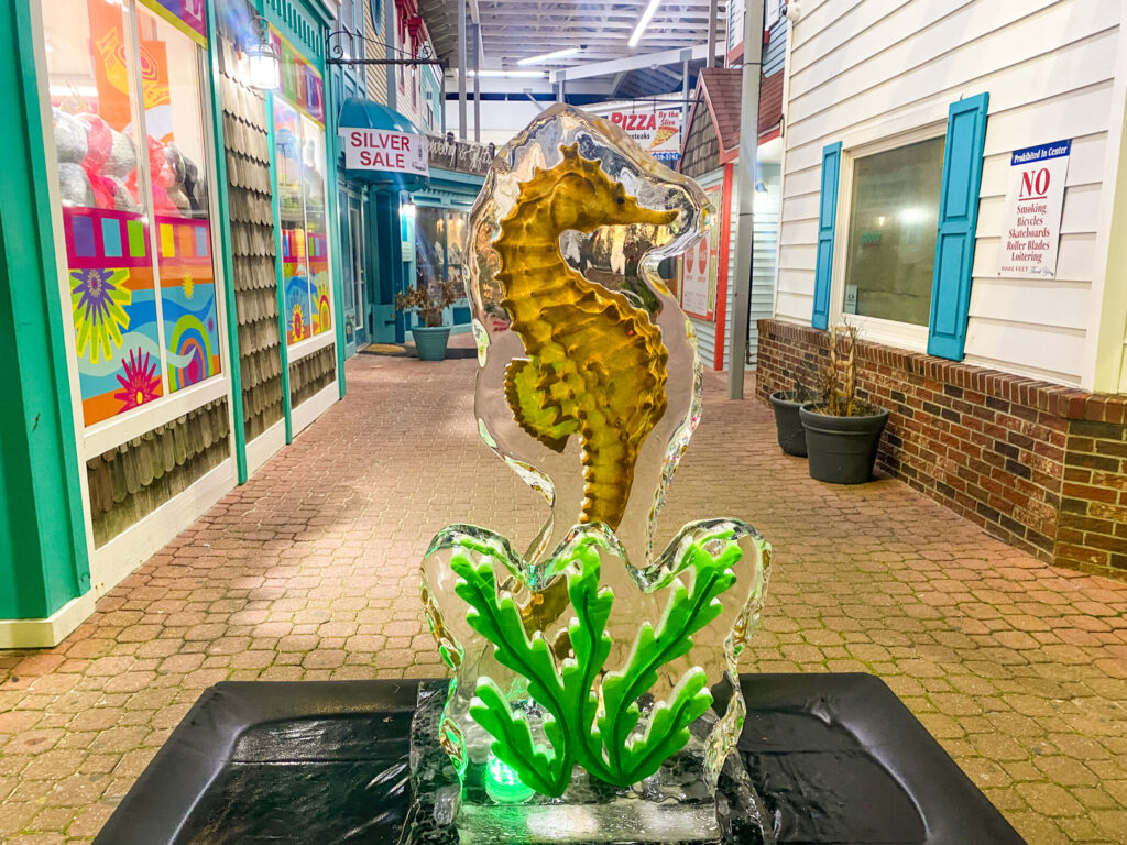 a statue of a sea horse in a shopping mall