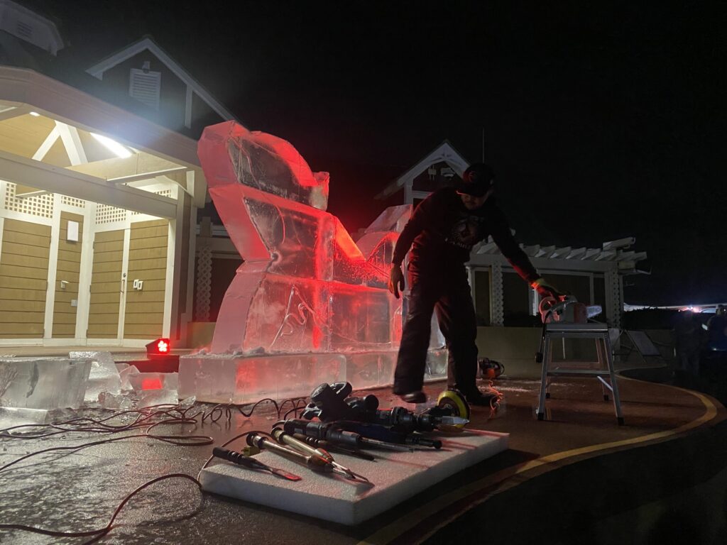 a man standing on top of an ice sculpture