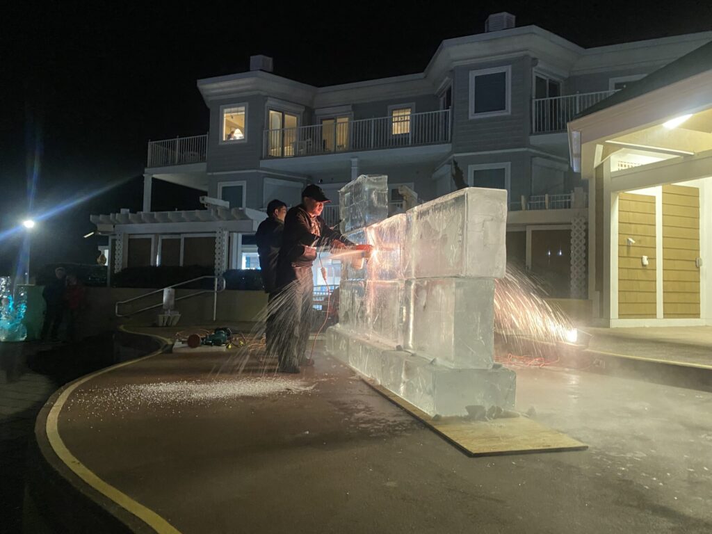 a couple of people standing next to a water fountain